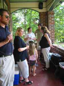 Bill, Sally. Emily, Tom and Sarah getting ready to cut the cake