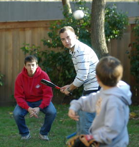 Robert pitches to Nick while Ian plays catcher