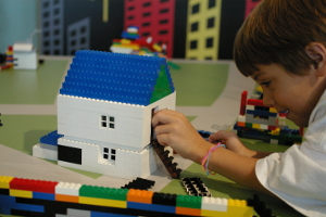 Robert working on a house at the Building Museum.