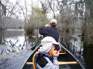 Steve paddling bow while Robert snacks