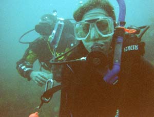 Sarah diving off of the Poor Knights Islands.