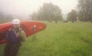 Sarah crosses the cow field at the bottom of the Mangles.