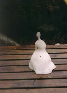 The melting snow man at the D. O. C. Mintaro Hut.
