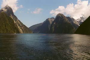 Milford Sound, for scale see the sea kayaks in the middle or two deck cruise ship hugging the shore under Mitre Peak (on the left)?