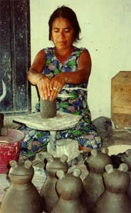 Potter spinning a pot.