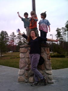 March 21, 2011 (phonecam) Dylan, Sebastian and Robert tower over Sarah.